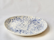 White porcelain medium plate with splatter detail