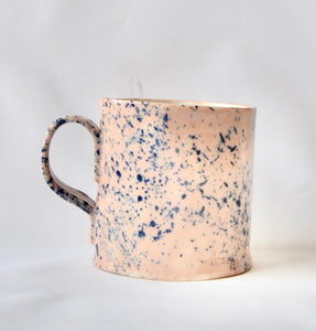 Salmon pink porcelain mug with splatter detail