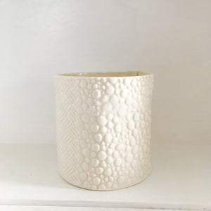 Textured Clay On Porcelain Pot