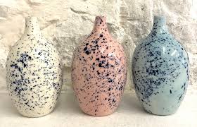 White, blue and rose pink porcelain vases with splatter detail